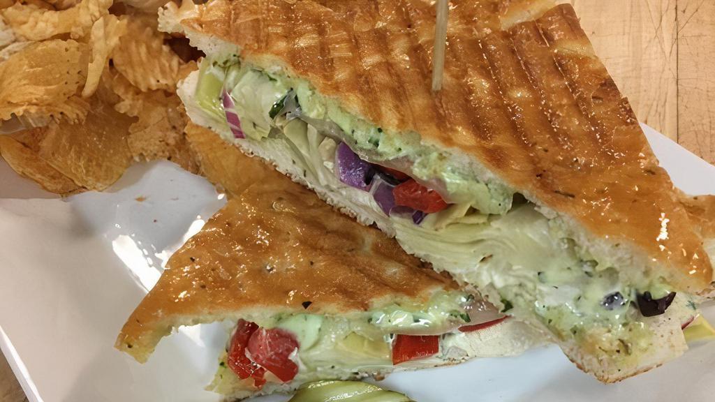 Mediterranean Panini · Artichoke hearts, Kalamata olives, roasted red peppers, red onion, provolone, fresh basil mayo and spinach on pressed focaccia served with choice of side.