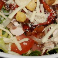 Garden Salad · Made with spring mix and iceberg lettuce, fresh mozzarella cheese, roma tomatoes, onions, ol...