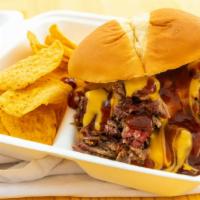 Brisket 'N' Cheddar · Our tender slow-smoked brisket smothered in a house-made cheddar cheese/smoked provolone che...