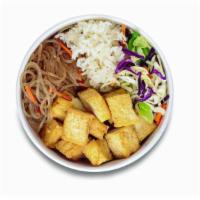 Doochi Bop (Vegetarian) · Korean style stir-fried tofu. Served with rice, cabbage mix, and noodle. *Vegan without lime...