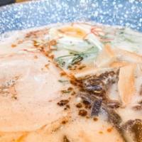 Haku Ramen · Tonkotsu broth topped with pork chashu, green onion, egg, mushroom and chili treads.