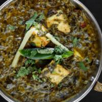 Saag Paneer · Spinach cooked with homemade cheese, onions, garlic, ginger, cream, and spices.