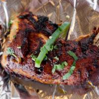 Chicken Tikka · Boneless chicken breast marinated in yogurt, garlic, ginger and spices, barbecued over tando...