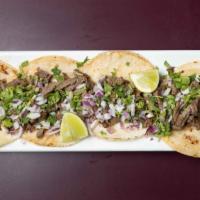 Street Tacos · House favorite. Four mini corn tortillas with your choice of meat (carne asada, pork carnita...
