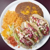 Fish Tacos · New! Three tortillas filled with lightly battered or grilled fish, topped with a tangy coles...