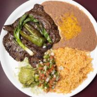 Carne Asada · House favorite. Choice tender filets of skirt steak char-broiled to perfection, served with ...
