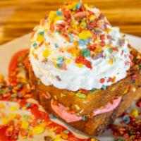 Fruity Pebbles Delight · Fresh brioche toast coated in fruity pebbles, housemade strawberry cream, garnished with whi...
