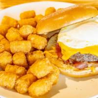 Breakfast Burger · Toasted brioche bun, seasoned American Wagyu steak patty, (1) egg, Cheddar cheese, apple woo...