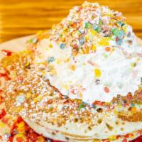 Fruity Pebbles Pancakes · (3) fruity pebbles mixed in pancake batter, topped with housemade strawberry cream, whipped ...