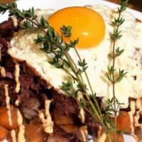 Corned Beef Hash · Perfectly seasoned corned beef, sautéed onions, over potatoes, and topped with (2) eggs, and...