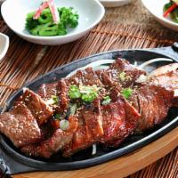 Kim Chee Beef Short Rib (R4) · Favorite. Sesame seeds, cucumbers, oiled scallions with chili-lime fish vinaigrette.