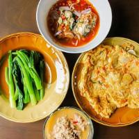 Panang Curry Tofu (R7) · Vegan, gluten free. Medium spiced vegan red coconut curry, sweet potatoes, carrots, Thai bas...