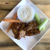Chicken Wings · Bone in chicken wings served with choice of choice of ranch, vegan ranch or blue cheese.