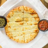 Cheesy Bread · Served with choice of sauce, choose your size, traditional or vegan.