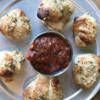 Vegan Garlic Knots · Hand crafted garlic knots smothered in garlic oil and finished with fresh garlic, herbs and ...
