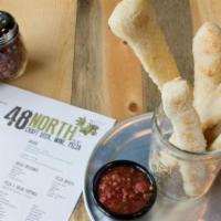 Breadsticks · Choice of one dipping sauce. Your option to make breadsticks vegan.