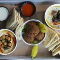 The Souk Platter · Tasting platter of hummus, baba ghanoush and falafel with loads of pita, labneh harissa, tah...