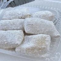 Mini Beignets · 6 mini freshly fried doughnuts covered in powdered sugar.