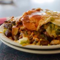 Pile Up · Our trademark a pile of pan fried potatoes, chopped bacon, chopped green chile, two eggs any...