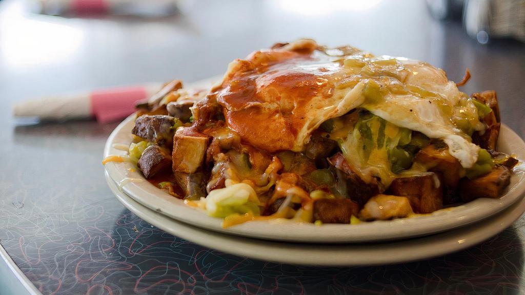 Pile Up · Our trademark a pile of pan fried potatoes, chopped bacon, chopped green chile, two eggs any style, cheddar cheese and red or green chile sauce on top.