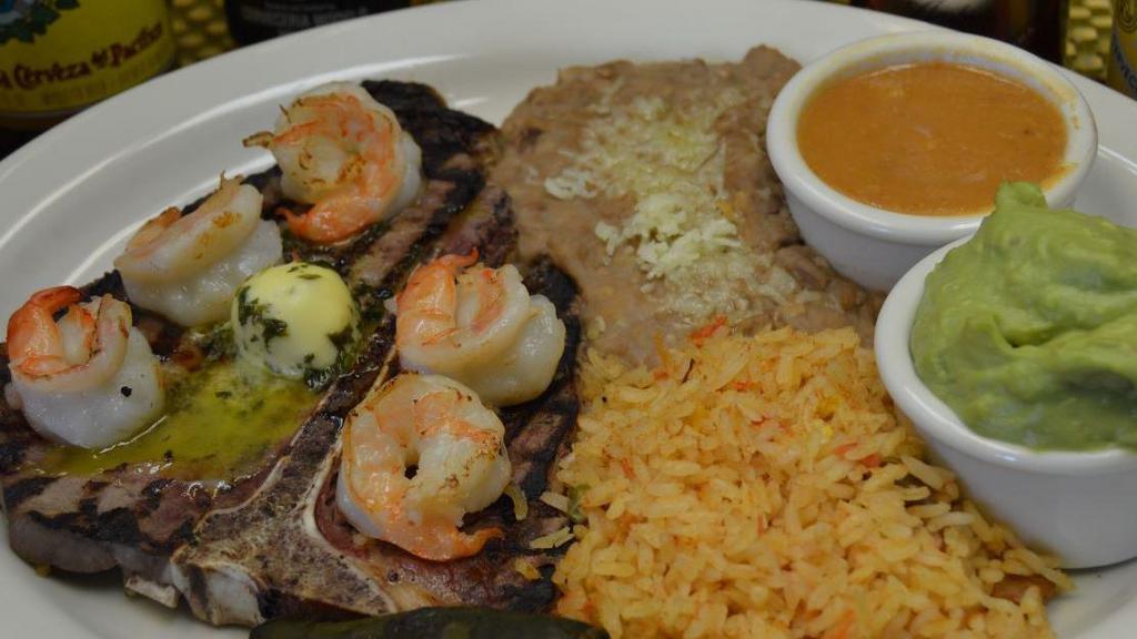 T-Bone Jalisco · New. A deliciously seasoned t-bone steak and grilled shrimp. Served with red or green chile, beans, rice, roasted jalapeño and a side of guacamole.