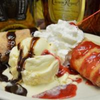 Cheesecake Burrito · A thin pastry wrapped filled with cream cheese, served with ice cream. Topped with chocolate...