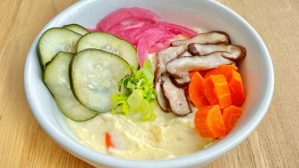 Potato Salad · mashed potatoes mixed with japanese mayo, garnished with pickled shiitake mushrooms, pickled cucumbers, pickled carrots and pickled red onions.
(gluten free)