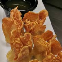 Crab Rangoon (6Pc) · Deep fried wonton stuffed with cream cheese and crab meat served with sweet and sour sauce.