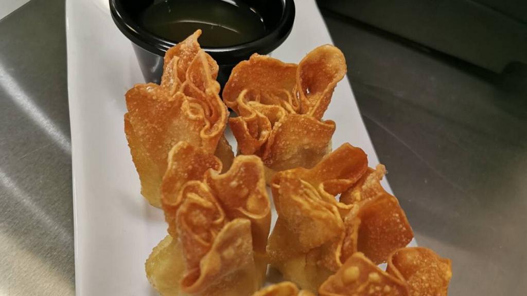 Crab Rangoon (6Pc) · Deep fried wonton stuffed with cream cheese and crab meat served with sweet and sour sauce.