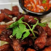 Beef Jerky · Deep fried marinated of beef served with chili sauce.