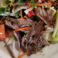 Beef Salad · Mix grilled beef, red onion, green onion, cilantro, lettuce, cucumber, carrot, and tomato wi...