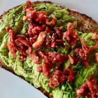 Avocado Toast · Vegetarian. Avocado, sundried tomatoes, chives, and garlic aioli. Served on an artisanal mul...