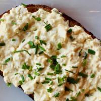 Egg Salad Toast · Vegetarian. Chopped boiled egg, pickled relish, chives, and garlic aioli. Served on an artis...