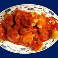 Sweet & Sour Pork · Deep fried chunks of boneless Pork, topped with pineapple and sweet and sour sauce.