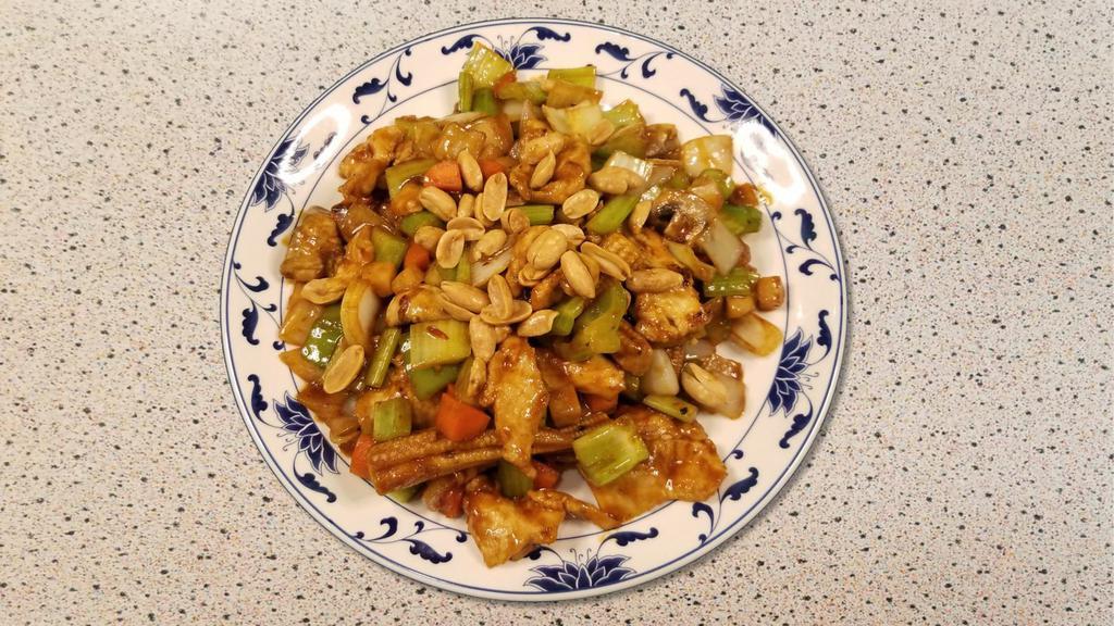 Kung Pao Chicken · Delicious Spicy Chicken stir fried with fresh cut to order vegetables, topped with house roasted peanuts