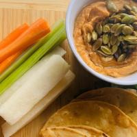 Red Pepper Hummus · Fire roasted red peppers blended with garbanzo beans, tahini, roasted garlic, lemon juice an...