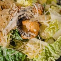 Small Caesar Salad  · Chopped romaine, white anchovies, house croutons,
caesar dressing, and parmesan crisp.