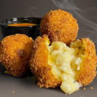 Mac & Cheese Bites · Macaroni in a creamy sauce of fontina, cheddar and Parmesan. Deep fried fresh and served wit...