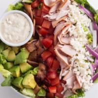Chef Salad · Mixed greens, turkey, bacon, feta, tomatoes, avocado, and red onions with bleu cheese dressi...
