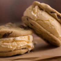 Ice Cream Sandwich · Vanilla ice cream, hand-scooped and lovingly nestled between two freshly baked chocolate chi...