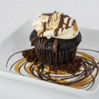 The Intern · Chocolate cake, espresso mousse filling,  vanilla buttercream, caramel drizzle, and chocolat...