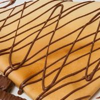 Twix Crepe · Our summer addition, Twix crepe stuffed with Twix sauce,  and powder sugar on top of it!