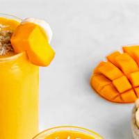  Mango Banana Smoothie  · Blend mangos, banana, vanilla yogurt, and milk in a blender until smooth.