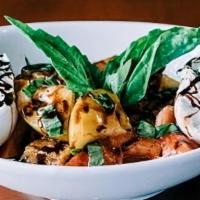 Heirloom Tomatoes Burrata · organic heirloom tomatoes, basil, balsamic glaze extra virgin olive oil and homemade croutons.