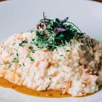 Seafood Risotto · arborio italian rice w/ smoked salmon, prawns, cream, and parmesan on top of our homemade lo...