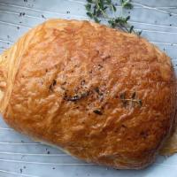 Ham, Swiss, & Thyme Croissant · Flaky croissant dough wrapped around black forest ham, swiss, and fresh thyme