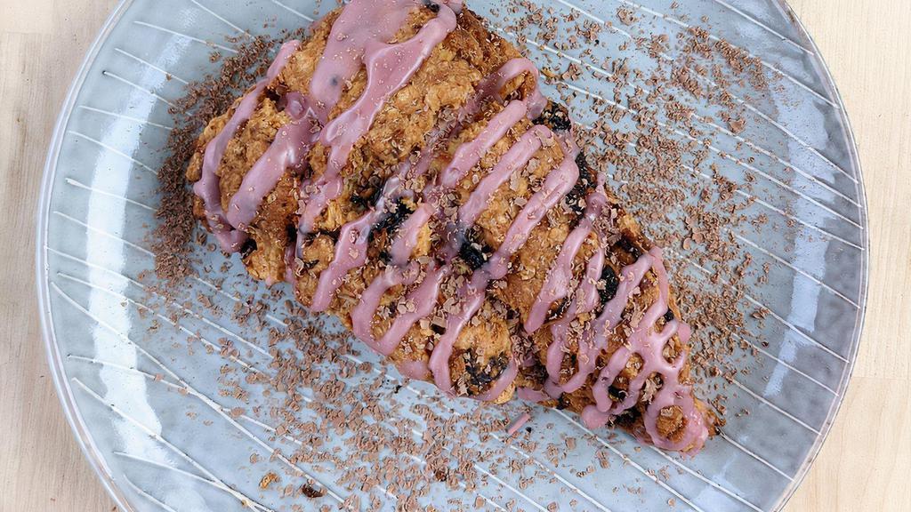 Blueberry Oat Scone · Our cream scone dotted with blueberries and oats topped with a maple glaze