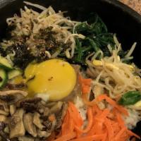 Bibimbap · Traditional mixed rice containing beef and various sauteed vegetables (zucchini, carrot, shi...
