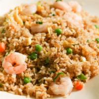 Fried Rice · Served with eggs, carrots, peas and green onions.