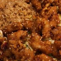 Sesame Chicken · Tender crispy white meat chicken glazed in a sweet brown sauce topped with sesame seeds.